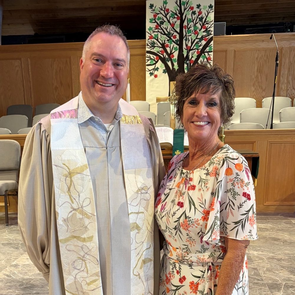A CRC representative with the pastor of Lely Presbyterian Church at the church's Minute for Mission